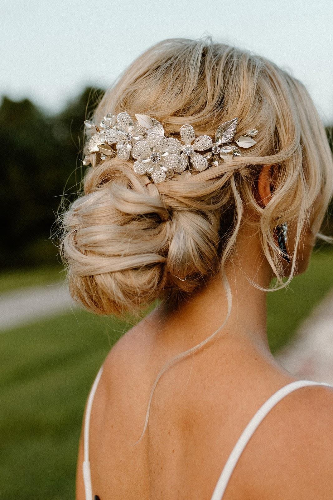 Orlando hair and makeup artists | Makeup Artist Orlando Beauty Brigade | Styled bridal updo with a silver floral pin