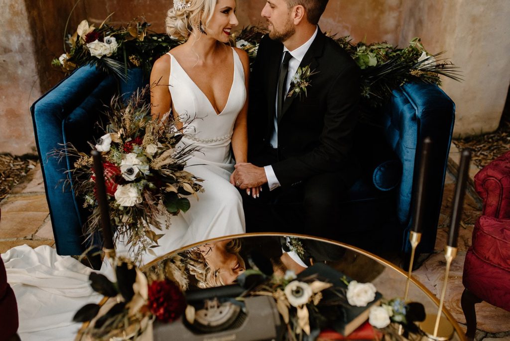 Orlando hair and makeup artists | Makeup Artist Orlando Beauty Brigade | Bride and groom smiling at each other while sitting