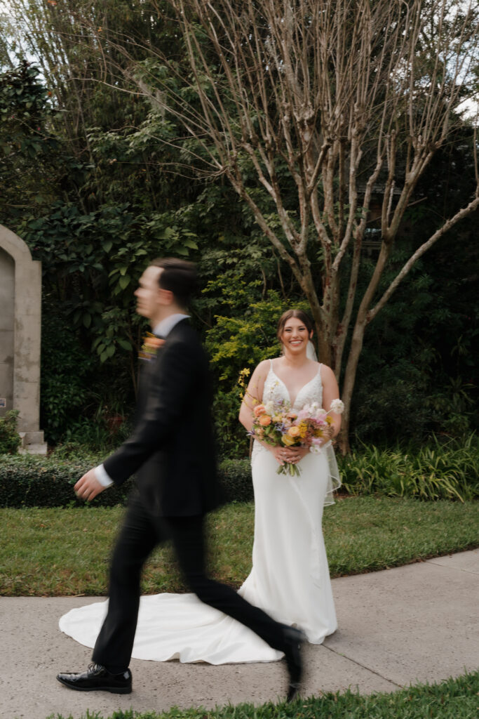 Hair and makeup in Orlando | Makeup Artist Orlando Beauty Brigade | Groom walking in front of bride with a stunning updo