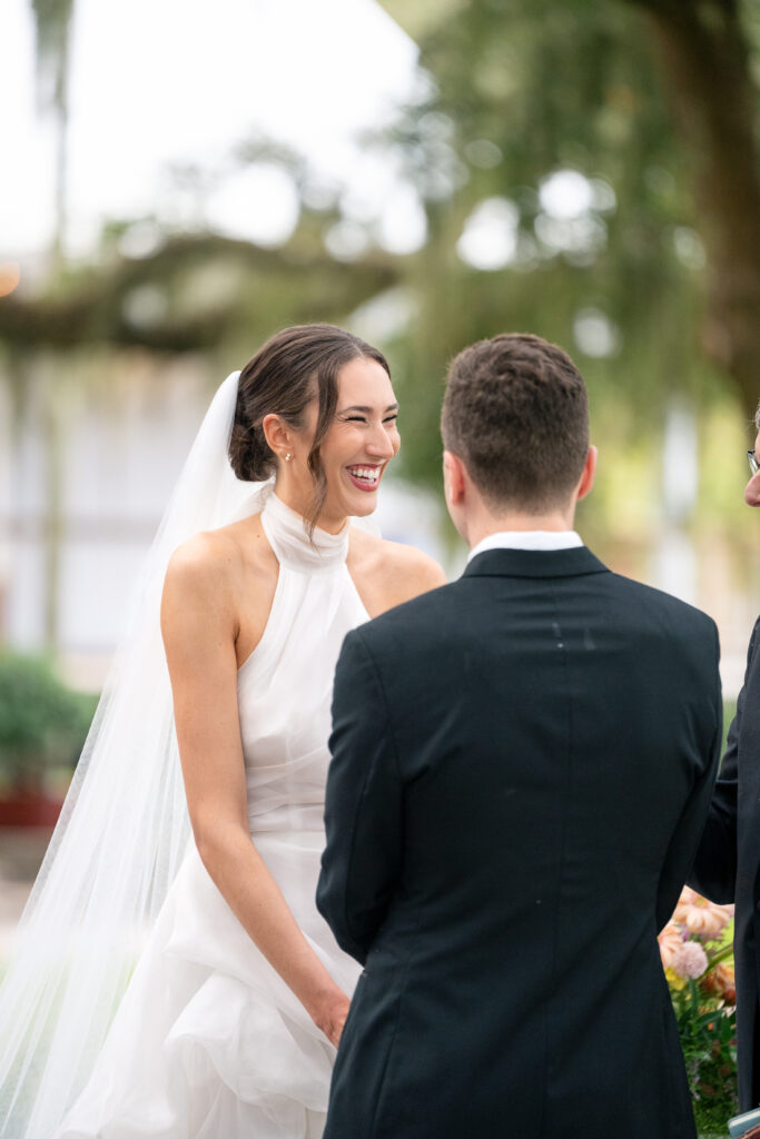 Bridal makeup and hair Orlando | Makeup Artist Orlando Beauty Brigade | Bride smiling on the altar with the groom