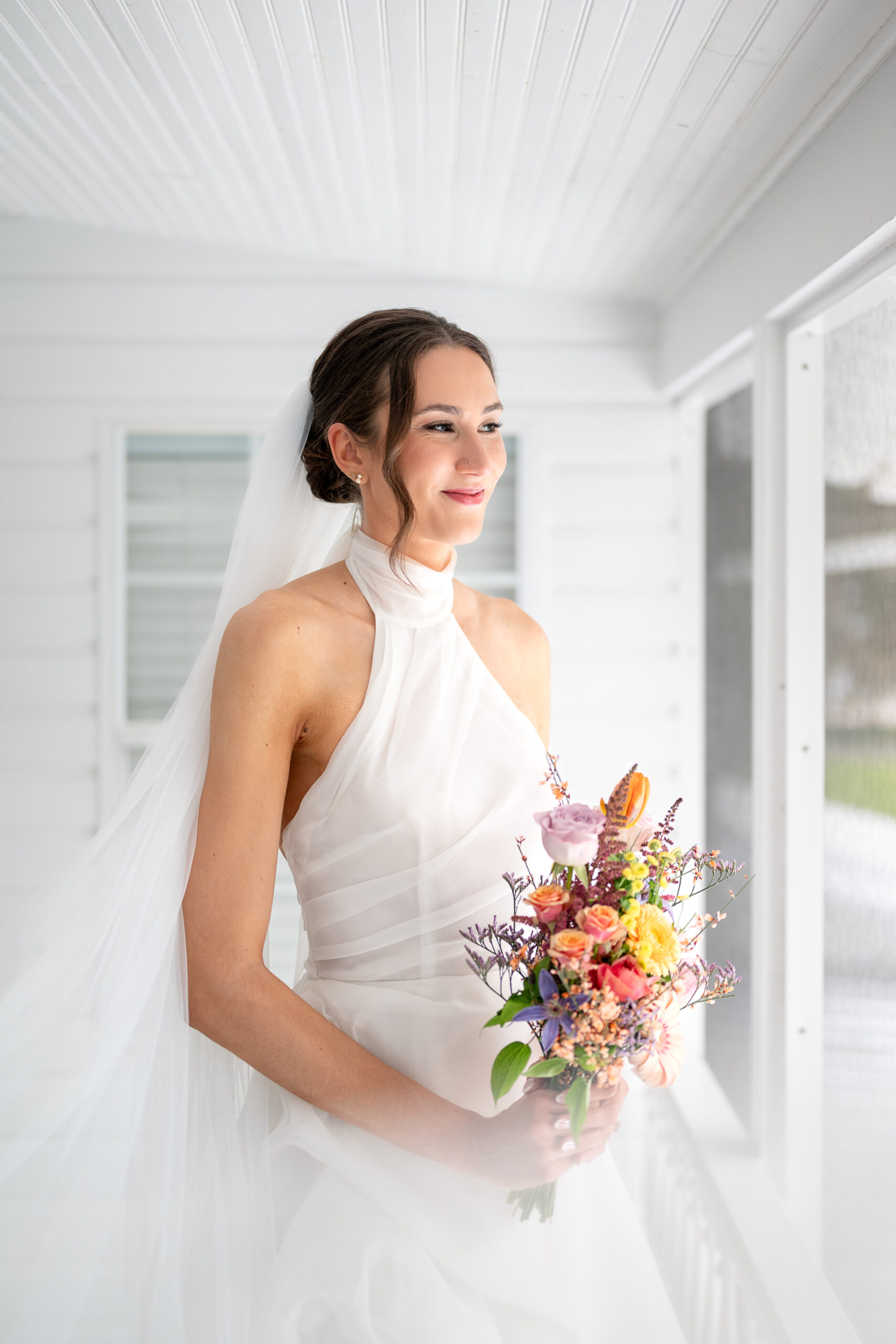 Bridal makeup and hair Orlando | Makeup Artist Orlando Beauty Brigade | Bride holding a bouquet