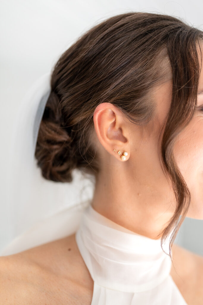 Bridal makeup and hair Orlando | Makeup Artist Orlando Beauty Brigade | Close up of bride's effortlessly styled updo