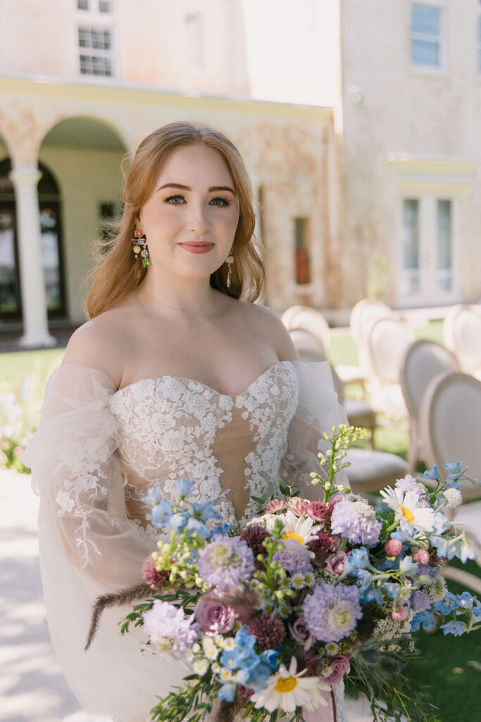 Orlando Wedding Hair and Makeup | Makeup Artist Orlando Beauty Brigade | Bride wearing an off shoulder dress with a half up half down hairstyle wearing an off shoulder dress