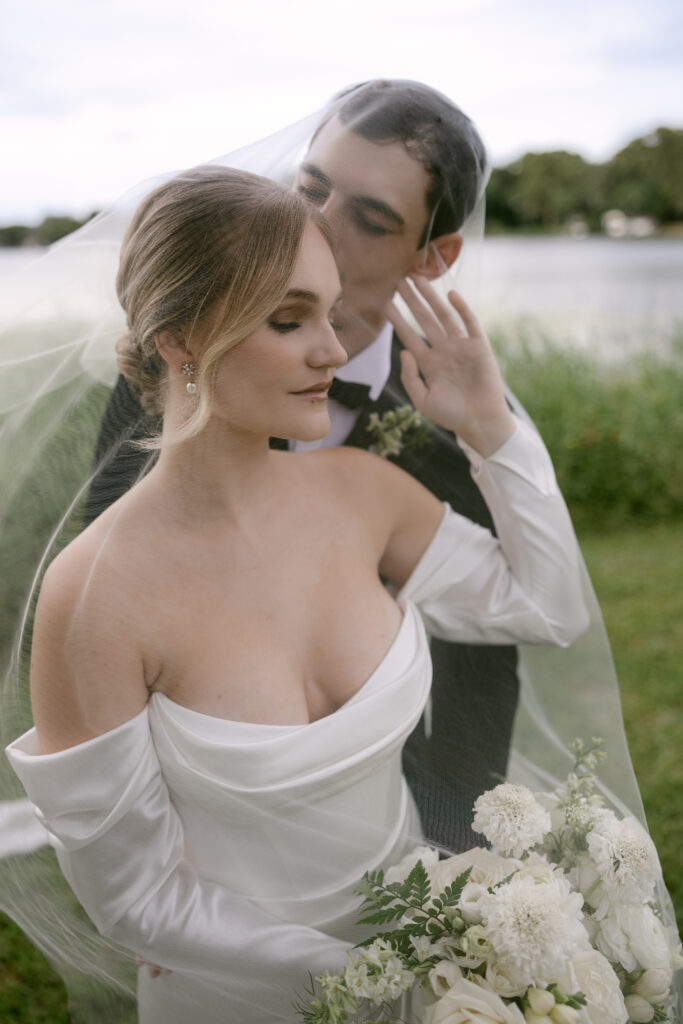 Orlando wedding makeup artist | Makeup Artist Orlando Beauty Brigade | Bride and groom embracing under the veil