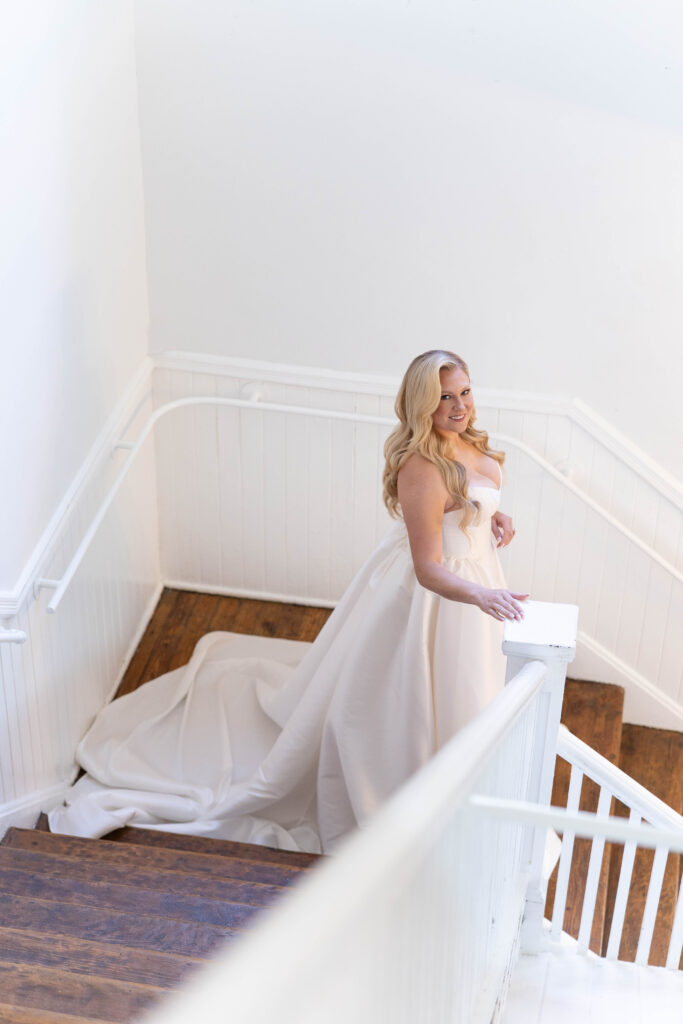 Tampa hair and makeup | Makeup Artist Orlando Beauty Brigade | Bride with styled curls walking down the stairs