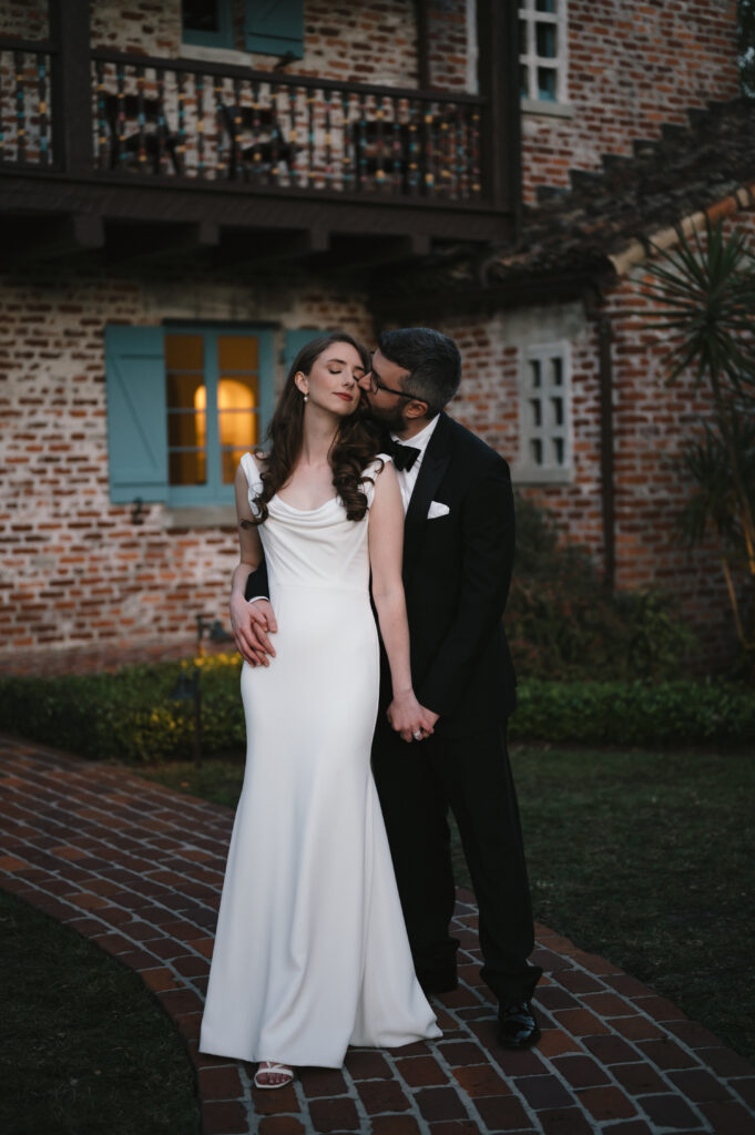 Orlando bridal hair and makeup | Makeup Artist Orlando Beauty Brigade | Groom kissing bride on the cheeks