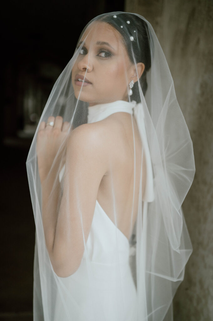 Orlando wedding hair and makeup cost | Makeup Artist Orlando Beauty Brigade | Bride with a veil and pearls on her hair