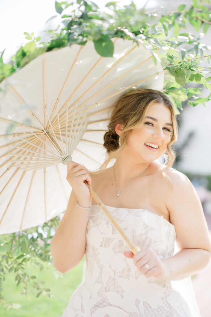 Orlando makeup bridal | Makeup Artist Orlando Beauty Brigade | Bride with soft glam makeup holding an umbrella