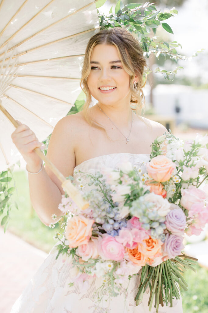 Orlando Wedding Hair and Makeup | Makeup Artist Orlando | Bride holding an umbrella and bouquet