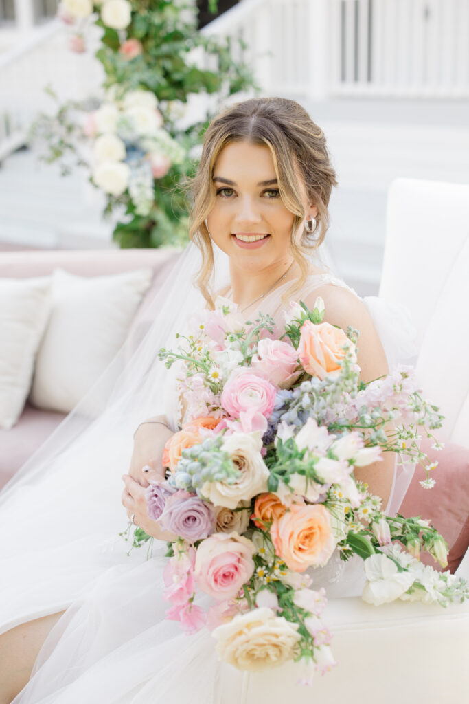 Orlando Wedding Hair and Makeup | Makeup Artist Orlando | Bride holding a blush pink bouquet