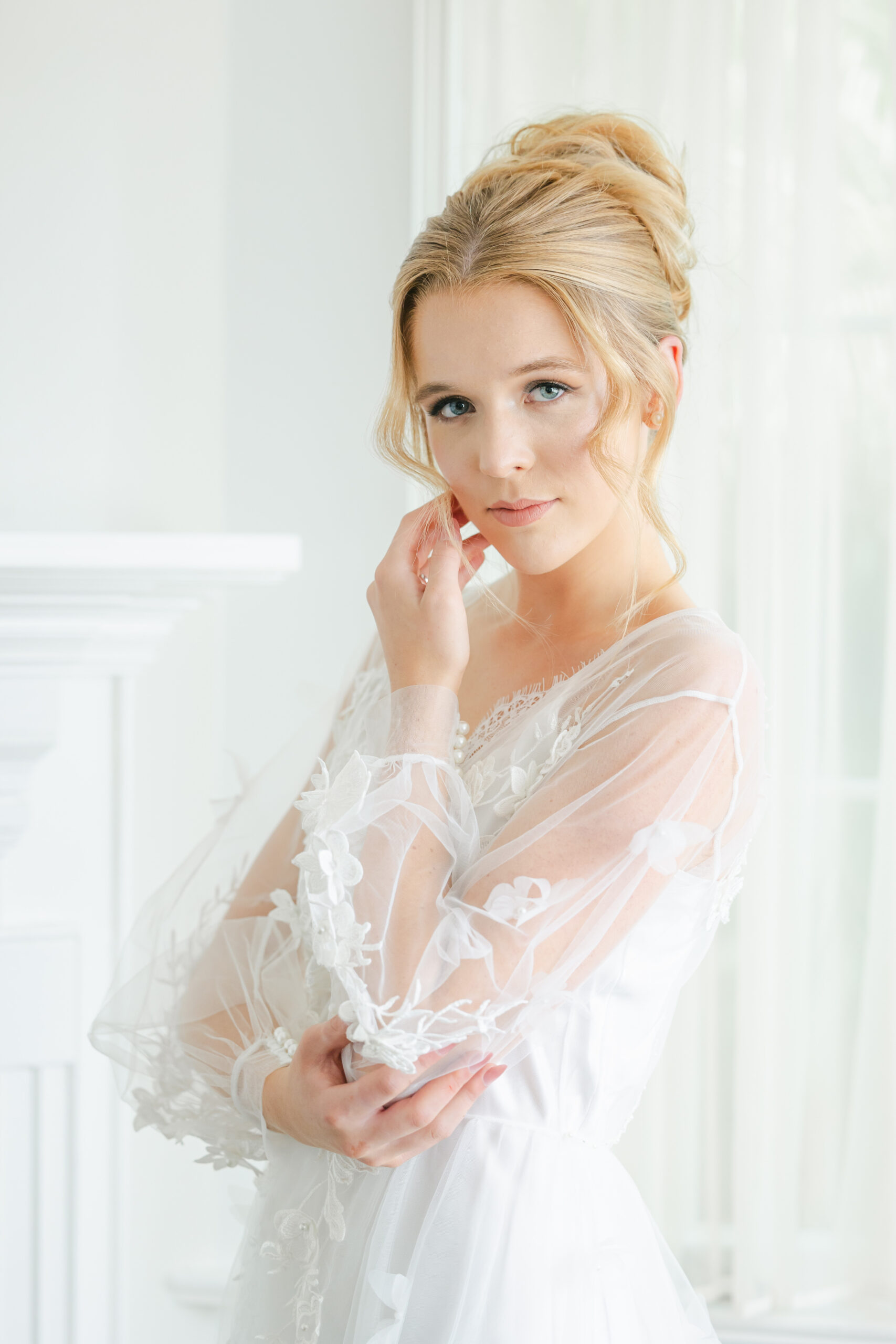 Orlando makeup artists | Makeup Artist Orlando Beauty Brigade | Bride in a robe with an effortlessly styled updo