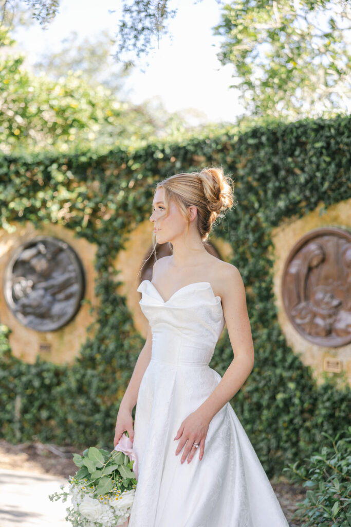 Orlando makeup artists | Makeup Artist Orlando Beauty Brigade | Bride standing on the garden with a styled updo